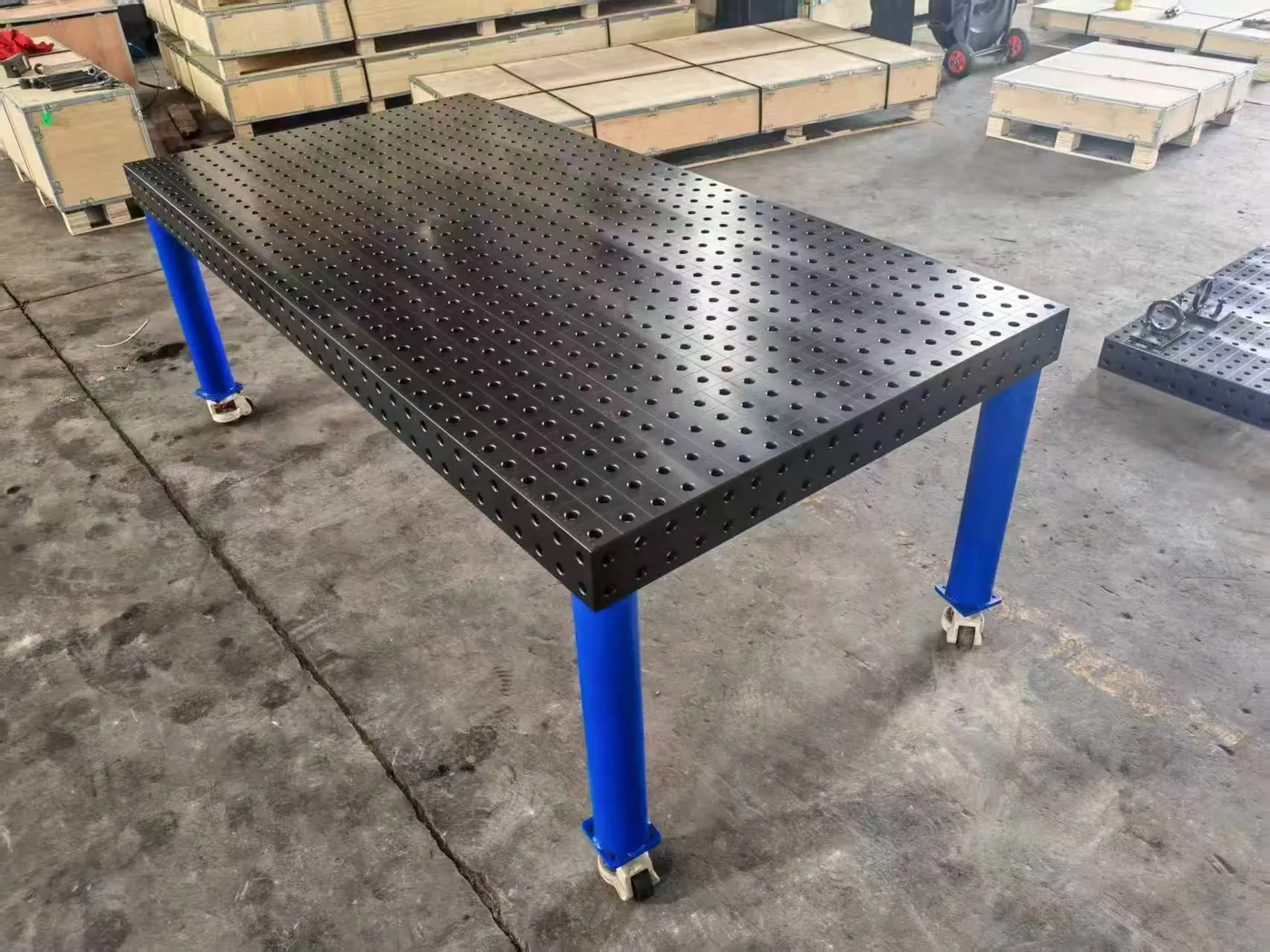 Nitrided steel 3D welding table with a dark surface and steel frame